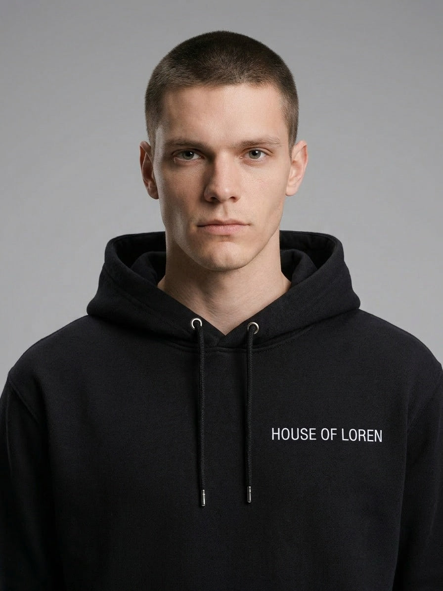 Close-up of the model wearing Signature Hoodie Unisex